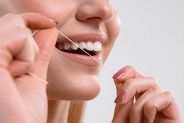 Вред и польза от зубной нити